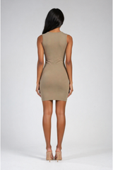 Woman wearing an olive dress on a white background