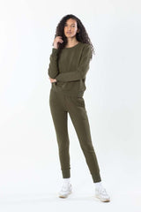 Model in olive sweatshirt with matching olive sweatpants, front view