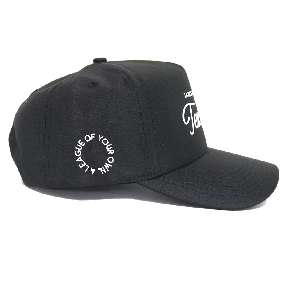 The No Rivals Tarleton Athletic Legacy Hat is a black premium cap with a curved brim, snap back adjustment, circular “LEAGUE OF YOUR OWN” white text on the side, and partially visible white front lettering.