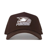The Georgia Southern Americano Hat is a dark brown cotton baseball cap with a structured fit, featuring a white eagle head logo and "GEORGIA SOUTHERN" embroidered on the front.