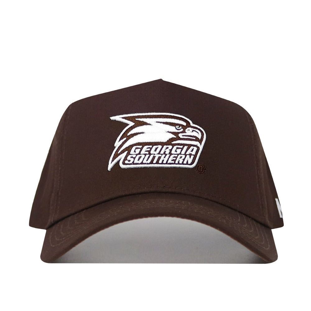 The Georgia Southern Americano Hat is a dark brown cotton baseball cap with a structured fit, featuring a white eagle head logo and "GEORGIA SOUTHERN" embroidered on the front.