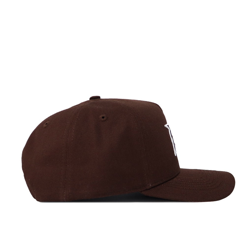Side view of the Georgia Southern Americano Hat, a brown snapback with a flat brim and partially visible white embroidered lettering. This structured cotton cap features ventilation eyelets on top and is displayed on a white background.