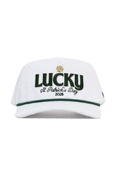 The No Rivals St.Pattys Lucky Cord Hat - White features "LUCKY" in green, a gold shamrock, “St. Patrick’s Day 2026” embroidered below, an unstructured fit, snapback closure, and green brim trim.