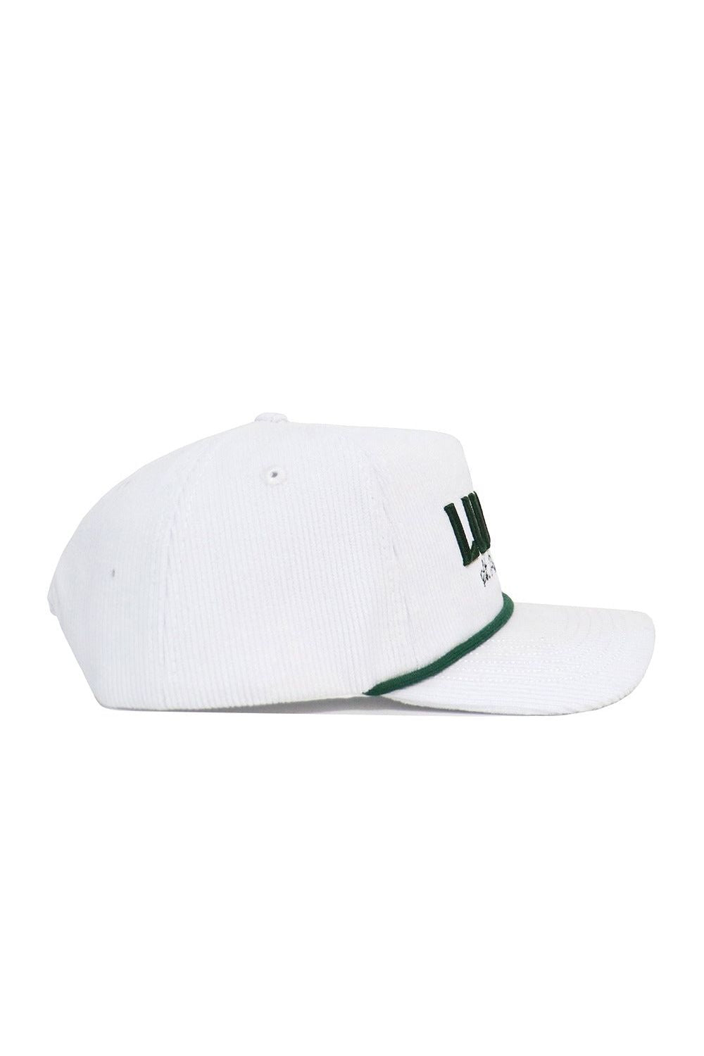 The No Rivals St.Pattys Lucky Cord Hat - White is a white corduroy hat with a green-accented brim and partial green text on the front, shown in side profile against a white background. It features an unstructured fit for casual comfort.