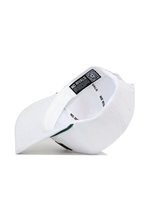 The St.Pattys Lucky Cord Hat - White by No Rivals is shown inside out, revealing the NO RIVALS label, inner lining, and a QR code on the tag.