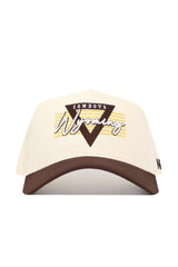 The Wyoming Triangle Game Cap Hat is a beige and brown snapback with "Cowboys Wyoming" embroidered in yellow, brown, and white on the front, featuring a triangle design and horizontal stripes. Made from high-quality cotton for comfort and structure.